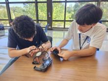 Students putting together drone